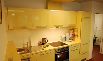 Kitchen with electric oven, ceramic hob, refrigerator, dishwasher, coffee machine, kettle and crockery and utensils for 6 people